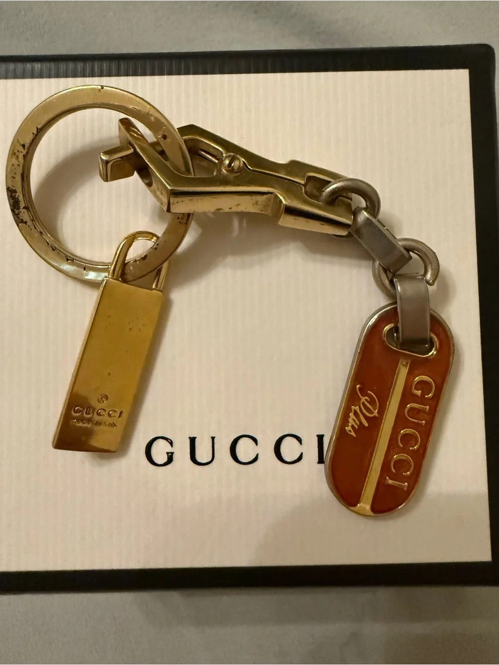 Gucci Plus mixed metal and red enamel keychain